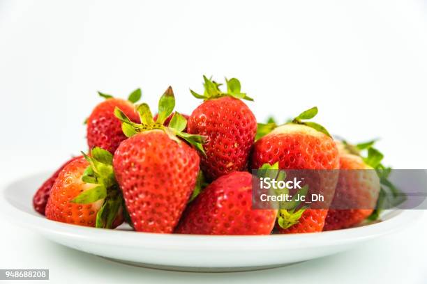 Strawberries In White Porcelain Dish With White Background Stock Photo - Download Image Now