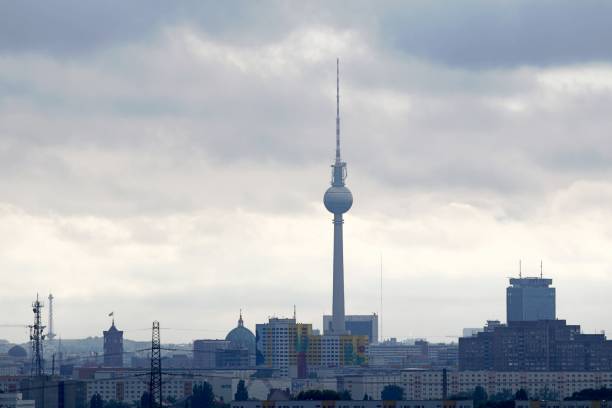 istock Communications Tower In City Against Cloudy Sky 948693034