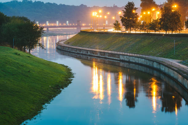 istock View Of Canal Amidst Field Over River During Sunset 948694982