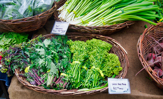 baskets of Rapini or Raab bundles at the farmer's market