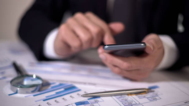 istock Financial expert making calculations on gadget, studying statistics in diagrams 948699036