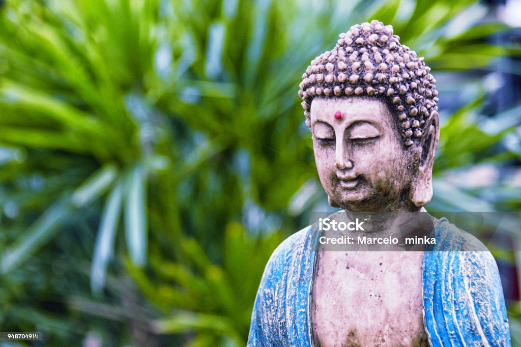 Buddha statue in the garden. Taken by Canon 60D. Post processing Adobe Lightroom and Photoshop. Buddha Stock Photo