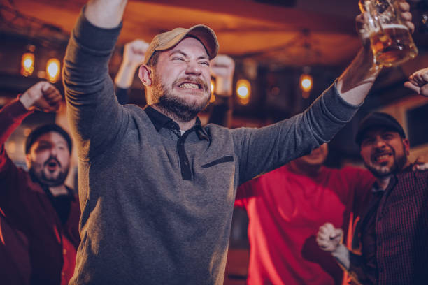 istock Excited fans in pub 948715720