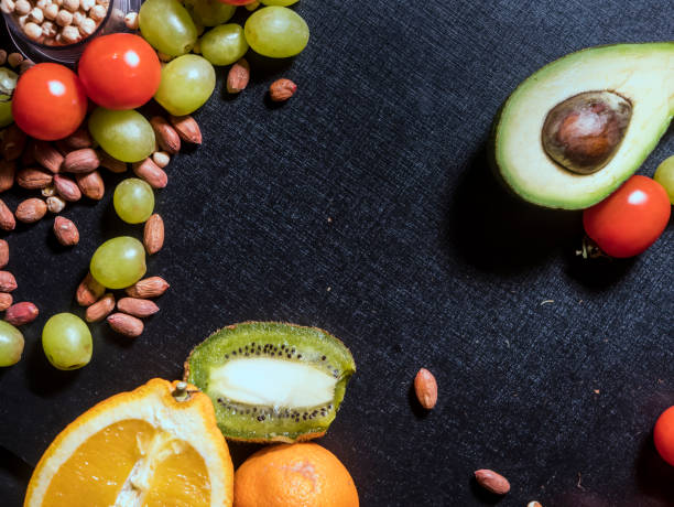 istock sport weight loss diet fresh food on dark surface 948716530