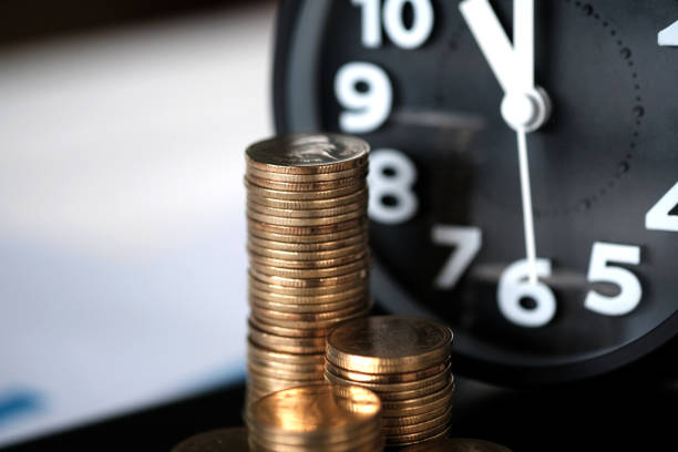 istock Step of coins stacks and alarm clock with tablet computer and financial graph, business planning vision and finance analysis concept. 948725366