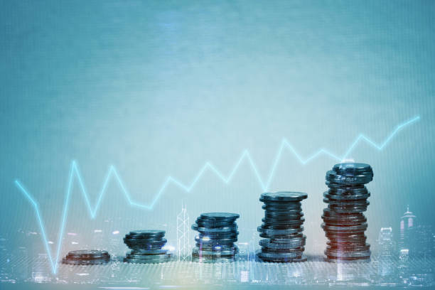 istock Double exposure Stack of coin with financial graph over city and office building background, business and financial concept. 948725468