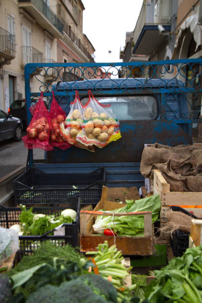 istock Comiso, Sicily: Little Blue Truck Selling Veggies 948729370