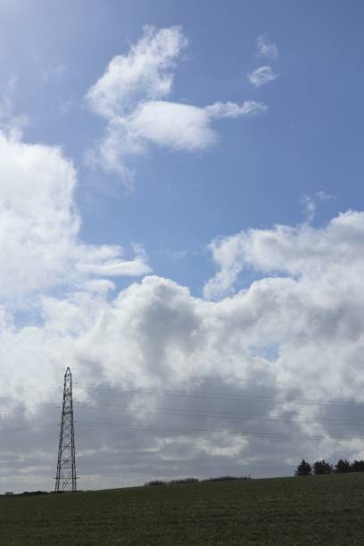 istock Cirrus and cumulus clouds in blue sky in rural setting 948733380