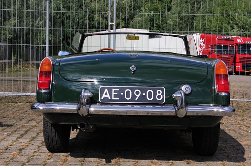 Brunssum, the Netherlands, - September 29 2015. Vintage sports car parked near the garage.