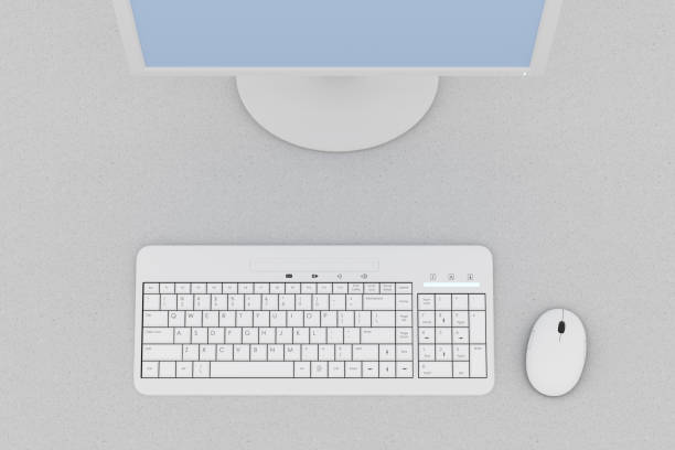 istock Top down view of desk with computer keyboard and mouse 948743798