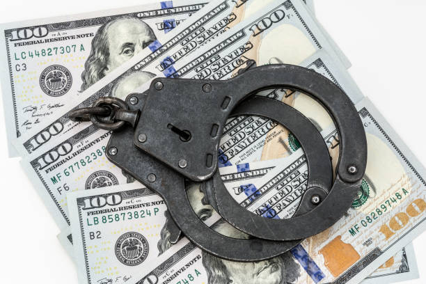 istock black metal handcuffs lie on 100 dollar bills 948749350