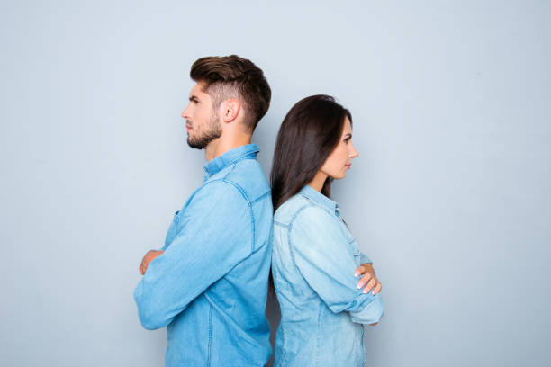 istock Two serious business coleagues standing back to back 948755704