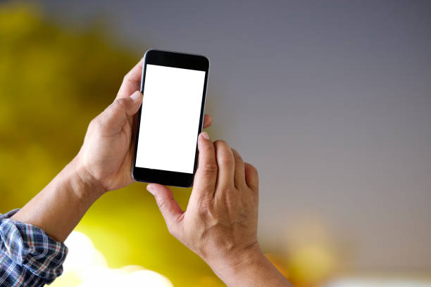 istock Close up male hand using a smart phone and night bokeh background. 948755962