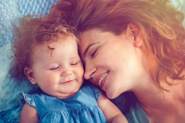 istock Mother and her baby daughter in park 948756880