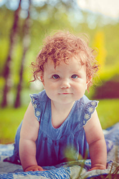 Baby girl in park in summer