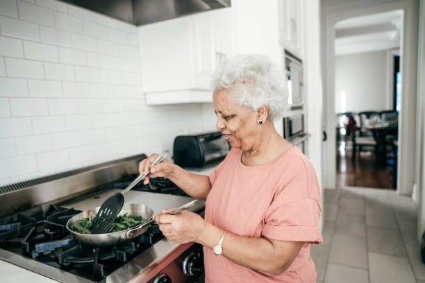 istock Grandmother cooking family dinner 948761798