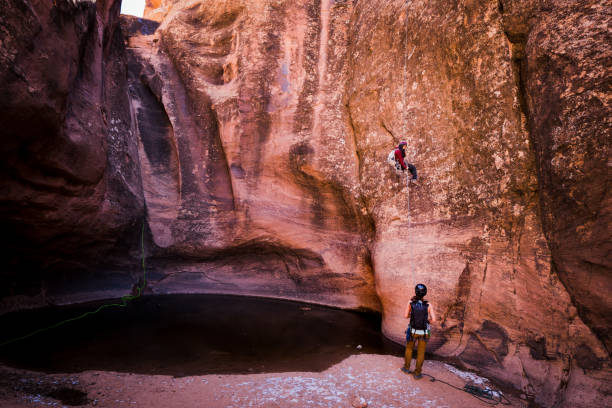 istock Athletic Young Woman Rappelling Near Moab Utah 948772582