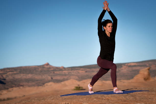 istock Yoga Instructor Starting the Warrior Pose Outside in Moab 948772632