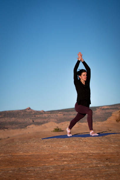 istock Yoga Instructor Starting the Warrior Pose Outside in Moab 948772638