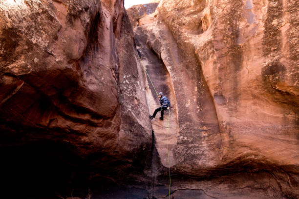 istock Athletic Young Man Rappelling Near Moab Utah 948772642