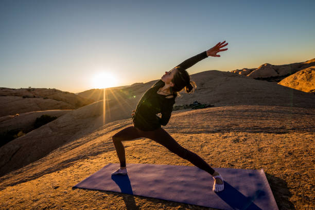 istock Yoga Instructor Starting the Warrior Pose Outside in Moab 948772700