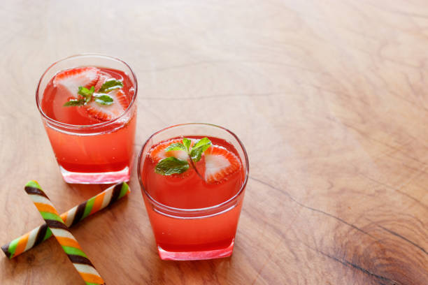 istock Summer strawberry drink on wooden table. 948775632
