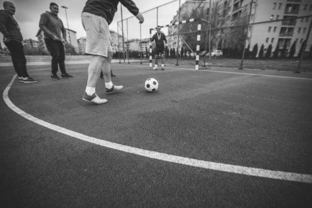 istock Men playing soccer outdoors 948775838