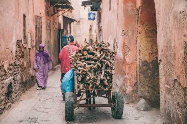 Marrakech,Morocco, 25th March 2018: People in traditional moroccan clothing walking in the Medina in Marrakech,Morocco.