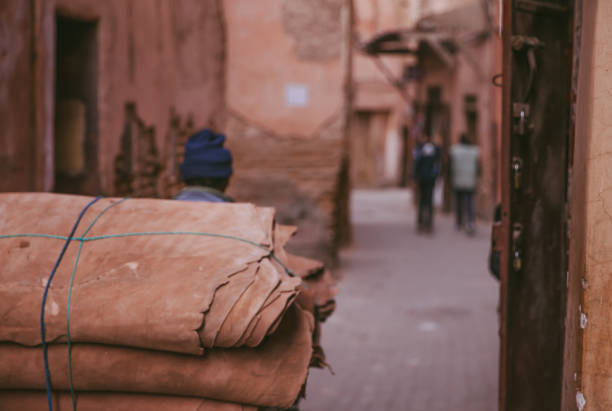 Marrakech,Morocco, 25th March 2018: People in traditional moroccan clothing walking in the Medina in Marrakech,Morocco.