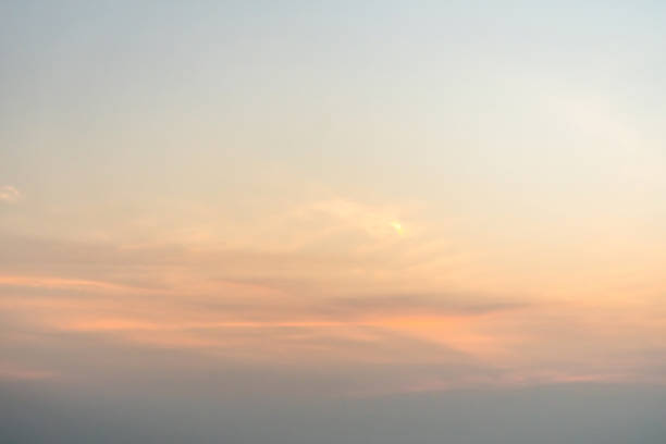 Yellow orange cloudy sky at dawn. The morning sunrise.