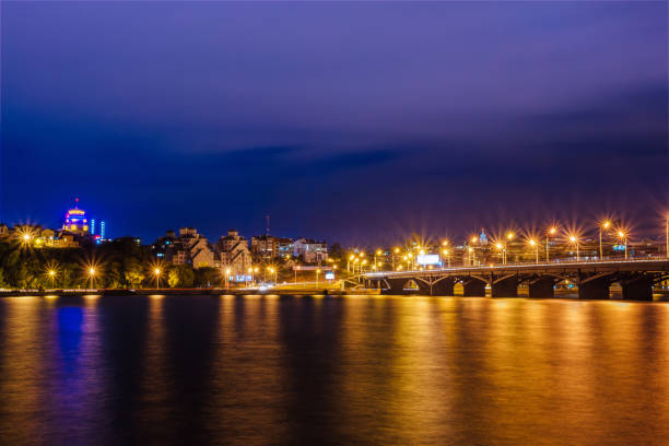 istock Night Voronezh skyline, bridge, modern houses, river. Copyspace 948797182
