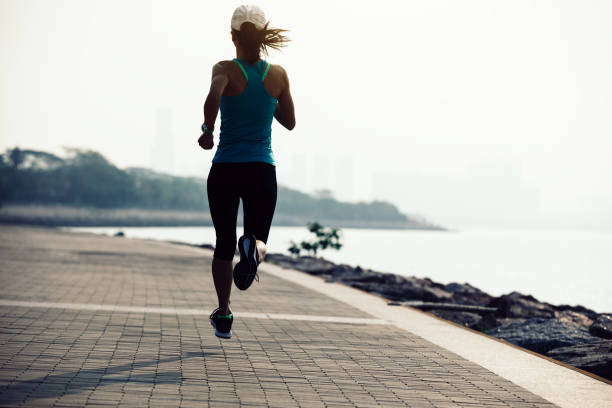istock Fitness sportswoman running on coast 948798544