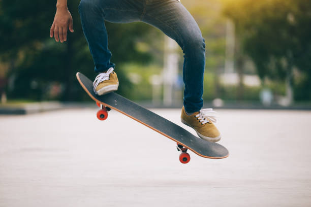 istock Skateboarder sakteboarding on parking lot 948804042