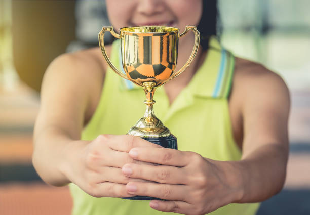 istock Midsection Of Woman Holding Trophy 948804642