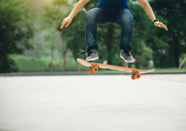 istock Skateboarder sakteboarding on parking lot 948804764