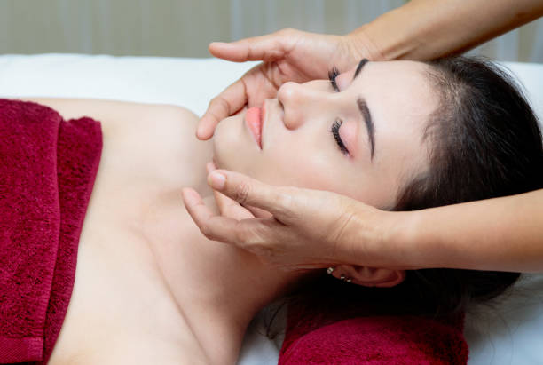istock Beautiful relaxing woman getting spa massage 948805338
