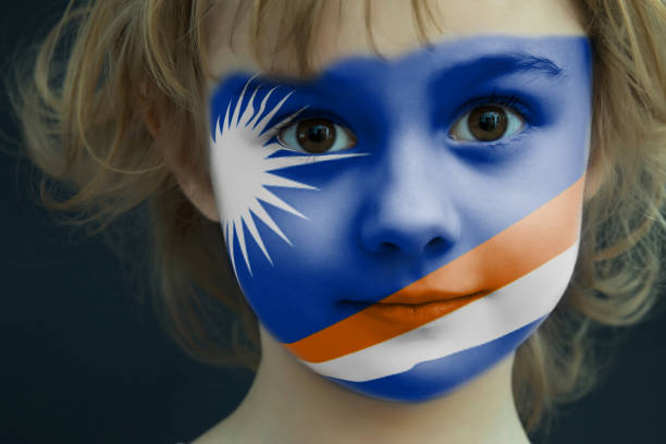 istock Child with a painted flag of Marshall Islands 948825350
