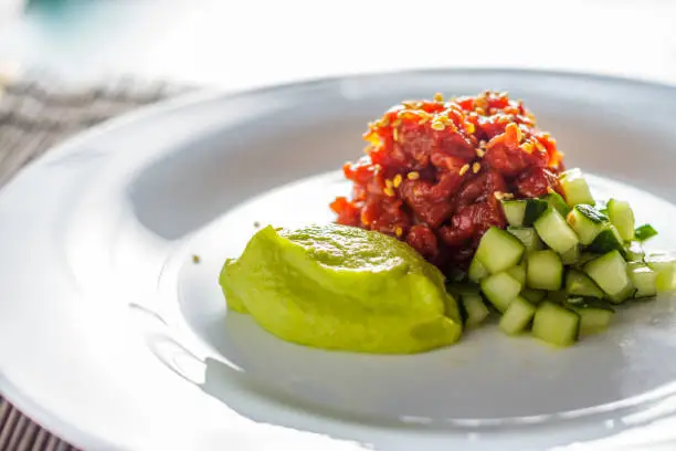 Tartare in hot sauce with avocado mousse horizontal
