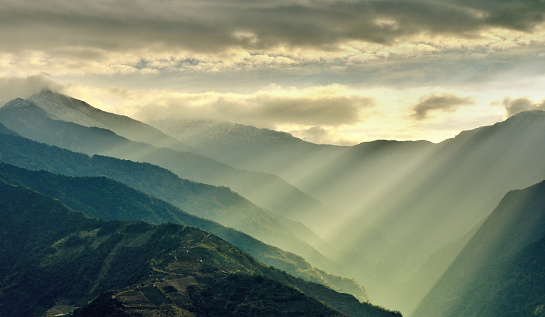 Sunlight beams through the fog on mountain at morning, Hehuan Mountain, Taiwan.