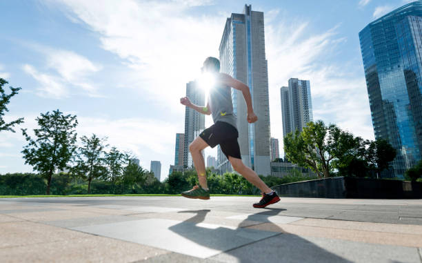 istock Man running in city street 948829236