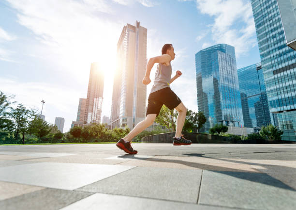istock Man running in city street 948829302