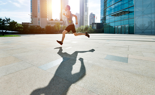 Man running in city street