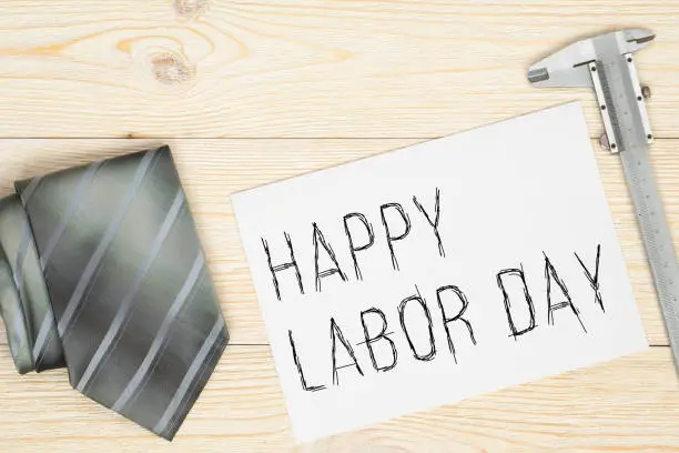 happy labor day, greetings card with neck tie and ruler