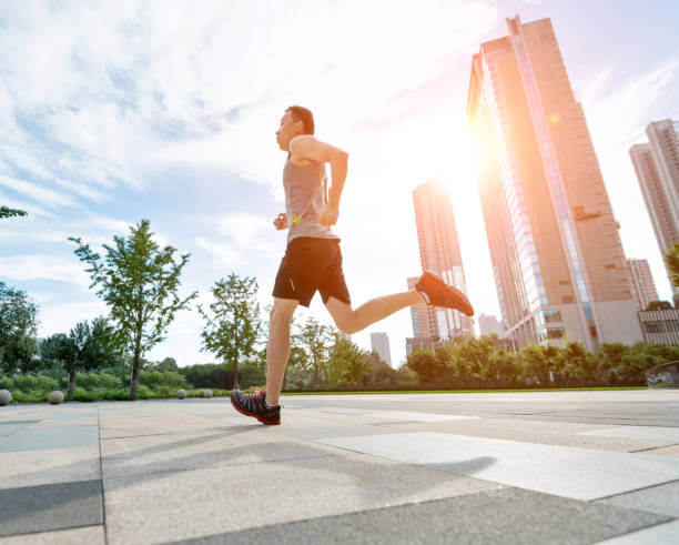 istock Man running in city street 948832202