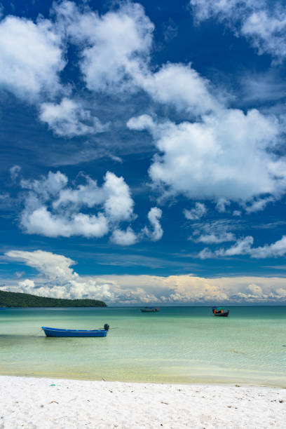 Tropical beach with turquoise clean water,  blue sky and white sand. Saracen Bay, Koh Rong Samloem. Cambodia, Asia.