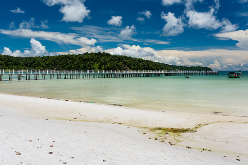 Tropical beach with turquoise clean water,  blue sky and white sand. Saracen Bay, Koh Rong Samloem. Cambodia, Asia.