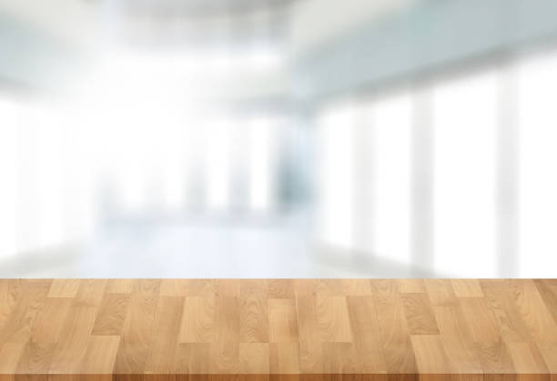 istock Wooden board empty table  window blurred background can be used for display or montage your products and Mock up 948834284