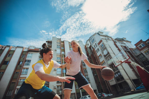 istock Girls playing streetbal 948842970