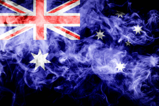 National flag of Australia from thick colored smoke on a black isolated background