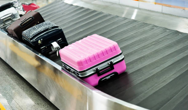 istock Suitcases on conveyor belt at the airport 948851538